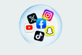 Six colorful social media platform icons arranged in a circular pattern within a translucent glass sphere: X (formerly Twitter) with a white X on black background in the top left, Instagram with its gradient logo in the top right, Facebook with its blue logo in the center, YouTube with a red play button on white background on the left, TikTok with a pink and white musical note on black background at the bottom, and Snapchat with a yellow ghost icon on the bottom right. The sphere sits on a light gray background with a subtle shadow effect.