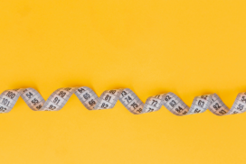 measuring tape with an orange background